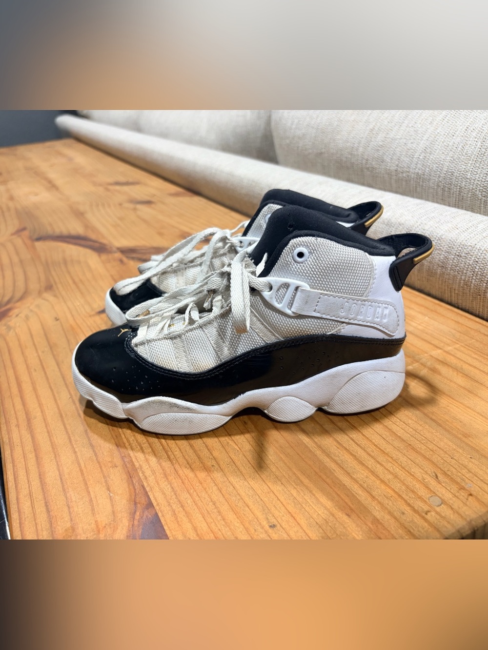 Jordan Nike Kids Black, White and Gold High-Top Sneakers